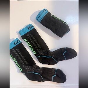 Bauer Youth Black & Blue Performance Skate Socks with Green Accents.
